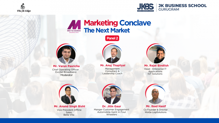 Promotional image for JK Business School's Marketing Conclave, featuring six panelists for Panel 2, including Mr. Varun Pasricha from Excitel Broadband as the moderator, Mr. Anuj Thapliyal, a Management Consultant & Leadership Coach, Mr. Rajat Bindlish from IGT Solutions, Mr. Anand Singh Bisht from Bella Vita, Dr. Jitin Gaur in the automotive sector, and Mr. Ibad Hanif from WaGa LogiSolutions. The event theme is centered on "The Next Market" in metaverse marketing.