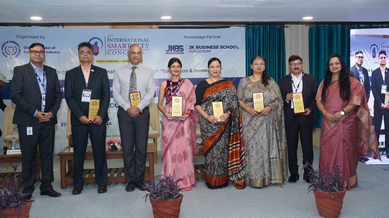 At the 2nd International Smart City Conclave 2026, hosted at JK Business School, Gurugram (JKBS), thought leaders, policymakers, and industry experts came together to discuss one of the most critical themes shaping modern India: Smart Cities and Sustainable Urban Development. Session 1, titled “Smart Cities, Sustainable Futures: Assessing India’s Urban Transformation Journey”, set the tone for the conclave by focusing on how innovation, governance, and sustainability are driving urban transformation across the country. Held on 27th March 2026, the session brought together a diverse panel of experts who shared practical insights, industry perspectives, and forward-looking ideas. Distinguished Speakers The session featured an accomplished panel of leaders from industry and academia: Dr. Sushil Aggarwal, Chairman, Avro Recycling Ltd Mr. Kalpesh Amin, Burlington English Dr. Lata Rani, Associate Professor, DSEU Ms. Ruma Batheja, Partner, Knowledgetics Research Mr. Rajarshi Banerjee, Chief Business Officer – Banking, LeadsConnect Mr. Sushil Dubey, CEO, Urja Global Limited Dr. Renu Singh, Sr. Trainer, Fintech, ISDC Global Dr. Sukhamaya Swain, Professor, JK Business School, Gurugram Each speaker brought a unique perspective, ranging from policy frameworks and financial ecosystems to sustainability practices and digital transformation in urban development. Key Discussion Highlights The session explored how India’s cities are evolving through: 1. Innovation-led Urban Development Speakers emphasized the role of technology, digital infrastructure, and smart governance systems in transforming urban spaces into efficient, citizen-centric ecosystems. 2. Sustainability as a Core Strategy Sustainable practices are no longer optional. The discussion highlighted how environmental responsibility is becoming central to urban planning, energy use, and infrastructure development. 3. Governance and Policy Integration Strong collaboration between government bodies, private sector players, and academic institutions is essential to drive scalable and impactful urban solutions. 4. Financial and Digital Ecosystems The role of fintech, data-driven decision-making, and investment frameworks was highlighted as a key enabler for smart city initiatives. Impactful Conversations and Insights From keynote perspectives to engaging panel discussions, the session provided a comprehensive view of how India’s urban future is being shaped by innovation, leadership, and sustainability-driven thinking. It also reinforced the importance of platforms like the International Smart City Conclave in fostering dialogue between academia and industry, aligning perfectly with JK Business School, Gurugram’s commitment to industry-integrated learning. The JKBS Edge At JK Business School, Gurugram, such initiatives reflect the institution’s focus on preparing students for real-world challenges. Through conclaves, industry interactions, and experiential learning, JKBS continues to build future-ready leaders equipped to contribute to evolving sectors like smart infrastructure, sustainability, and digital transformation. Backed by the 140+ years legacy of the JK Organisation, JKBS stands as The perfect Eco-Centre of Success, bridging academic excellence with industry relevance. Conclusion Session 1 of the conclave successfully laid the foundation for deeper discussions by addressing critical questions around urban transformation. It highlighted a clear message: The future of cities lies at the intersection of innovation, sustainability, and collaborative leadership. At the 2nd International Smart City Conclave 2026, hosted at JK Business School, Gurugram (JKBS), thought leaders, policymakers, and industry experts came together to discuss one of the most critical themes shaping modern India: Smart Cities and Sustainable Urban Development. Session 1, titled “Smart Cities, Sustainable Futures: Assessing India’s Urban Transformation Journey”, set the tone for the conclave by focusing on how innovation, governance, and sustainability are driving urban transformation across the country. Held on 27th March 2026, the session brought together a diverse panel of experts who shared practical insights, industry perspectives, and forward-looking ideas. Distinguished Speakers The session featured an accomplished panel of leaders from industry and academia: Dr. Sushil Aggarwal, Chairman, Avro Recycling Ltd Mr. Kalpesh Amin, Burlington English Dr. Lata Rani, Associate Professor, DSEU Ms. Ruma Batheja, Partner, Knowledgetics Research Mr. Rajarshi Banerjee, Chief Business Officer – Banking, LeadsConnect Mr. Sushil Dubey, CEO, Urja Global Limited Dr. Renu Singh, Sr. Trainer, Fintech, ISDC Global Dr. Sukhamaya Swain, Professor, JK Business School, Gurugram Each speaker brought a unique perspective, ranging from policy frameworks and financial ecosystems to sustainability practices and digital transformation in urban development. Key Discussion Highlights The session explored how India’s cities are evolving through: 1. Innovation-led Urban Development Speakers emphasized the role of technology, digital infrastructure, and smart governance systems in transforming urban spaces into efficient, citizen-centric ecosystems. 2. Sustainability as a Core Strategy Sustainable practices are no longer optional. The discussion highlighted how environmental responsibility is becoming central to urban planning, energy use, and infrastructure development. 3. Governance and Policy Integration Strong collaboration between government bodies, private sector players, and academic institutions is essential to drive scalable and impactful urban solutions. 4. Financial and Digital Ecosystems The role of fintech, data-driven decision-making, and investment frameworks was highlighted as a key enabler for smart city initiatives. Impactful Conversations and Insights From keynote perspectives to engaging panel discussions, the session provided a comprehensive view of how India’s urban future is being shaped by innovation, leadership, and sustainability-driven thinking. It also reinforced the importance of platforms like the International Smart City Conclave in fostering dialogue between academia and industry, aligning perfectly with JK Business School, Gurugram’s commitment to industry-integrated learning. The JKBS Edge At JK Business School, Gurugram, such initiatives reflect the institution’s focus on preparing students for real-world challenges. Through conclaves, industry interactions, and experiential learning, JKBS continues to build future-ready leaders equipped to contribute to evolving sectors like smart infrastructure, sustainability, and digital transformation. Backed by the 140+ years legacy of the JK Organisation, JKBS stands as The perfect Eco-Centre of Success, bridging academic excellence with industry relevance. Conclusion Session 1 of the conclave successfully laid the foundation for deeper discussions by addressing critical questions around urban transformation. It highlighted a clear message: The future of cities lies at the intersection of innovation, sustainability, and collaborative leadership.