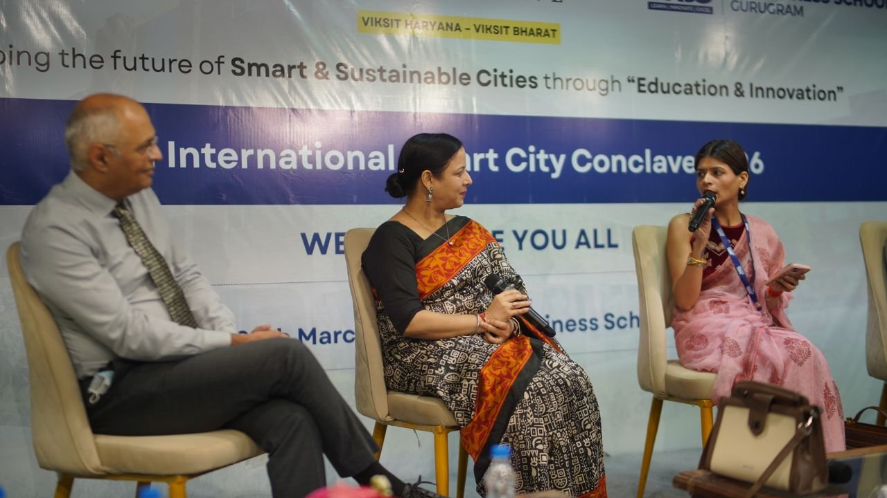 At the 2nd International Smart City Conclave 2026, hosted at JK Business School, Gurugram (JKBS), thought leaders, policymakers, and industry experts came together to discuss one of the most critical themes shaping modern India: Smart Cities and Sustainable Urban Development. Session 1, titled “Smart Cities, Sustainable Futures: Assessing India’s Urban Transformation Journey”, set the tone for the conclave by focusing on how innovation, governance, and sustainability are driving urban transformation across the country. Held on 27th March 2026, the session brought together a diverse panel of experts who shared practical insights, industry perspectives, and forward-looking ideas. Distinguished Speakers The session featured an accomplished panel of leaders from industry and academia: Dr. Sushil Aggarwal, Chairman, Avro Recycling Ltd Mr. Kalpesh Amin, Burlington English Dr. Lata Rani, Associate Professor, DSEU Ms. Ruma Batheja, Partner, Knowledgetics Research Mr. Rajarshi Banerjee, Chief Business Officer – Banking, LeadsConnect Mr. Sushil Dubey, CEO, Urja Global Limited Dr. Renu Singh, Sr. Trainer, Fintech, ISDC Global Dr. Sukhamaya Swain, Professor, JK Business School, Gurugram Each speaker brought a unique perspective, ranging from policy frameworks and financial ecosystems to sustainability practices and digital transformation in urban development. Key Discussion Highlights The session explored how India’s cities are evolving through: 1. Innovation-led Urban Development Speakers emphasized the role of technology, digital infrastructure, and smart governance systems in transforming urban spaces into efficient, citizen-centric ecosystems. 2. Sustainability as a Core Strategy Sustainable practices are no longer optional. The discussion highlighted how environmental responsibility is becoming central to urban planning, energy use, and infrastructure development. 3. Governance and Policy Integration Strong collaboration between government bodies, private sector players, and academic institutions is essential to drive scalable and impactful urban solutions. 4. Financial and Digital Ecosystems The role of fintech, data-driven decision-making, and investment frameworks was highlighted as a key enabler for smart city initiatives. Impactful Conversations and Insights From keynote perspectives to engaging panel discussions, the session provided a comprehensive view of how India’s urban future is being shaped by innovation, leadership, and sustainability-driven thinking. It also reinforced the importance of platforms like the International Smart City Conclave in fostering dialogue between academia and industry, aligning perfectly with JK Business School, Gurugram’s commitment to industry-integrated learning. The JKBS Edge At JK Business School, Gurugram, such initiatives reflect the institution’s focus on preparing students for real-world challenges. Through conclaves, industry interactions, and experiential learning, JKBS continues to build future-ready leaders equipped to contribute to evolving sectors like smart infrastructure, sustainability, and digital transformation. Backed by the 140+ years legacy of the JK Organisation, JKBS stands as The perfect Eco-Centre of Success, bridging academic excellence with industry relevance. Conclusion Session 1 of the conclave successfully laid the foundation for deeper discussions by addressing critical questions around urban transformation. It highlighted a clear message: The future of cities lies at the intersection of innovation, sustainability, and collaborative leadership. At the 2nd International Smart City Conclave 2026, hosted at JK Business School, Gurugram (JKBS), thought leaders, policymakers, and industry experts came together to discuss one of the most critical themes shaping modern India: Smart Cities and Sustainable Urban Development. Session 1, titled “Smart Cities, Sustainable Futures: Assessing India’s Urban Transformation Journey”, set the tone for the conclave by focusing on how innovation, governance, and sustainability are driving urban transformation across the country. Held on 27th March 2026, the session brought together a diverse panel of experts who shared practical insights, industry perspectives, and forward-looking ideas. Distinguished Speakers The session featured an accomplished panel of leaders from industry and academia: Dr. Sushil Aggarwal, Chairman, Avro Recycling Ltd Mr. Kalpesh Amin, Burlington English Dr. Lata Rani, Associate Professor, DSEU Ms. Ruma Batheja, Partner, Knowledgetics Research Mr. Rajarshi Banerjee, Chief Business Officer – Banking, LeadsConnect Mr. Sushil Dubey, CEO, Urja Global Limited Dr. Renu Singh, Sr. Trainer, Fintech, ISDC Global Dr. Sukhamaya Swain, Professor, JK Business School, Gurugram Each speaker brought a unique perspective, ranging from policy frameworks and financial ecosystems to sustainability practices and digital transformation in urban development. Key Discussion Highlights The session explored how India’s cities are evolving through: 1. Innovation-led Urban Development Speakers emphasized the role of technology, digital infrastructure, and smart governance systems in transforming urban spaces into efficient, citizen-centric ecosystems. 2. Sustainability as a Core Strategy Sustainable practices are no longer optional. The discussion highlighted how environmental responsibility is becoming central to urban planning, energy use, and infrastructure development. 3. Governance and Policy Integration Strong collaboration between government bodies, private sector players, and academic institutions is essential to drive scalable and impactful urban solutions. 4. Financial and Digital Ecosystems The role of fintech, data-driven decision-making, and investment frameworks was highlighted as a key enabler for smart city initiatives. Impactful Conversations and Insights From keynote perspectives to engaging panel discussions, the session provided a comprehensive view of how India’s urban future is being shaped by innovation, leadership, and sustainability-driven thinking. It also reinforced the importance of platforms like the International Smart City Conclave in fostering dialogue between academia and industry, aligning perfectly with JK Business School, Gurugram’s commitment to industry-integrated learning. The JKBS Edge At JK Business School, Gurugram, such initiatives reflect the institution’s focus on preparing students for real-world challenges. Through conclaves, industry interactions, and experiential learning, JKBS continues to build future-ready leaders equipped to contribute to evolving sectors like smart infrastructure, sustainability, and digital transformation. Backed by the 140+ years legacy of the JK Organisation, JKBS stands as The perfect Eco-Centre of Success, bridging academic excellence with industry relevance. Conclusion Session 1 of the conclave successfully laid the foundation for deeper discussions by addressing critical questions around urban transformation. It highlighted a clear message: The future of cities lies at the intersection of innovation, sustainability, and collaborative leadership.