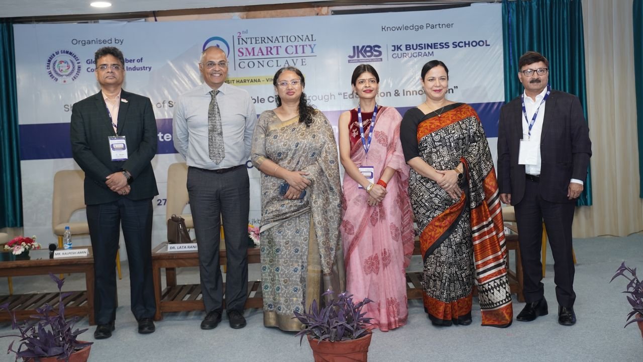 At the 2nd International Smart City Conclave 2026, hosted at JK Business School, Gurugram (JKBS), thought leaders, policymakers, and industry experts came together to discuss one of the most critical themes shaping modern India: Smart Cities and Sustainable Urban Development. Session 1, titled “Smart Cities, Sustainable Futures: Assessing India’s Urban Transformation Journey”, set the tone for the conclave by focusing on how innovation, governance, and sustainability are driving urban transformation across the country. Held on 27th March 2026, the session brought together a diverse panel of experts who shared practical insights, industry perspectives, and forward-looking ideas. Distinguished Speakers The session featured an accomplished panel of leaders from industry and academia: Dr. Sushil Aggarwal, Chairman, Avro Recycling Ltd Mr. Kalpesh Amin, Burlington English Dr. Lata Rani, Associate Professor, DSEU Ms. Ruma Batheja, Partner, Knowledgetics Research Mr. Rajarshi Banerjee, Chief Business Officer – Banking, LeadsConnect Mr. Sushil Dubey, CEO, Urja Global Limited Dr. Renu Singh, Sr. Trainer, Fintech, ISDC Global Dr. Sukhamaya Swain, Professor, JK Business School, Gurugram Each speaker brought a unique perspective, ranging from policy frameworks and financial ecosystems to sustainability practices and digital transformation in urban development. Key Discussion Highlights The session explored how India’s cities are evolving through: 1. Innovation-led Urban Development Speakers emphasized the role of technology, digital infrastructure, and smart governance systems in transforming urban spaces into efficient, citizen-centric ecosystems. 2. Sustainability as a Core Strategy Sustainable practices are no longer optional. The discussion highlighted how environmental responsibility is becoming central to urban planning, energy use, and infrastructure development. 3. Governance and Policy Integration Strong collaboration between government bodies, private sector players, and academic institutions is essential to drive scalable and impactful urban solutions. 4. Financial and Digital Ecosystems The role of fintech, data-driven decision-making, and investment frameworks was highlighted as a key enabler for smart city initiatives. Impactful Conversations and Insights From keynote perspectives to engaging panel discussions, the session provided a comprehensive view of how India’s urban future is being shaped by innovation, leadership, and sustainability-driven thinking. It also reinforced the importance of platforms like the International Smart City Conclave in fostering dialogue between academia and industry, aligning perfectly with JK Business School, Gurugram’s commitment to industry-integrated learning. The JKBS Edge At JK Business School, Gurugram, such initiatives reflect the institution’s focus on preparing students for real-world challenges. Through conclaves, industry interactions, and experiential learning, JKBS continues to build future-ready leaders equipped to contribute to evolving sectors like smart infrastructure, sustainability, and digital transformation. Backed by the 140+ years legacy of the JK Organisation, JKBS stands as The perfect Eco-Centre of Success, bridging academic excellence with industry relevance. Conclusion Session 1 of the conclave successfully laid the foundation for deeper discussions by addressing critical questions around urban transformation. It highlighted a clear message: The future of cities lies at the intersection of innovation, sustainability, and collaborative leadership. At the 2nd International Smart City Conclave 2026, hosted at JK Business School, Gurugram (JKBS), thought leaders, policymakers, and industry experts came together to discuss one of the most critical themes shaping modern India: Smart Cities and Sustainable Urban Development. Session 1, titled “Smart Cities, Sustainable Futures: Assessing India’s Urban Transformation Journey”, set the tone for the conclave by focusing on how innovation, governance, and sustainability are driving urban transformation across the country. Held on 27th March 2026, the session brought together a diverse panel of experts who shared practical insights, industry perspectives, and forward-looking ideas. Distinguished Speakers The session featured an accomplished panel of leaders from industry and academia: Dr. Sushil Aggarwal, Chairman, Avro Recycling Ltd Mr. Kalpesh Amin, Burlington English Dr. Lata Rani, Associate Professor, DSEU Ms. Ruma Batheja, Partner, Knowledgetics Research Mr. Rajarshi Banerjee, Chief Business Officer – Banking, LeadsConnect Mr. Sushil Dubey, CEO, Urja Global Limited Dr. Renu Singh, Sr. Trainer, Fintech, ISDC Global Dr. Sukhamaya Swain, Professor, JK Business School, Gurugram Each speaker brought a unique perspective, ranging from policy frameworks and financial ecosystems to sustainability practices and digital transformation in urban development. Key Discussion Highlights The session explored how India’s cities are evolving through: 1. Innovation-led Urban Development Speakers emphasized the role of technology, digital infrastructure, and smart governance systems in transforming urban spaces into efficient, citizen-centric ecosystems. 2. Sustainability as a Core Strategy Sustainable practices are no longer optional. The discussion highlighted how environmental responsibility is becoming central to urban planning, energy use, and infrastructure development. 3. Governance and Policy Integration Strong collaboration between government bodies, private sector players, and academic institutions is essential to drive scalable and impactful urban solutions. 4. Financial and Digital Ecosystems The role of fintech, data-driven decision-making, and investment frameworks was highlighted as a key enabler for smart city initiatives. Impactful Conversations and Insights From keynote perspectives to engaging panel discussions, the session provided a comprehensive view of how India’s urban future is being shaped by innovation, leadership, and sustainability-driven thinking. It also reinforced the importance of platforms like the International Smart City Conclave in fostering dialogue between academia and industry, aligning perfectly with JK Business School, Gurugram’s commitment to industry-integrated learning. The JKBS Edge At JK Business School, Gurugram, such initiatives reflect the institution’s focus on preparing students for real-world challenges. Through conclaves, industry interactions, and experiential learning, JKBS continues to build future-ready leaders equipped to contribute to evolving sectors like smart infrastructure, sustainability, and digital transformation. Backed by the 140+ years legacy of the JK Organisation, JKBS stands as The perfect Eco-Centre of Success, bridging academic excellence with industry relevance. Conclusion Session 1 of the conclave successfully laid the foundation for deeper discussions by addressing critical questions around urban transformation. It highlighted a clear message: The future of cities lies at the intersection of innovation, sustainability, and collaborative leadership.